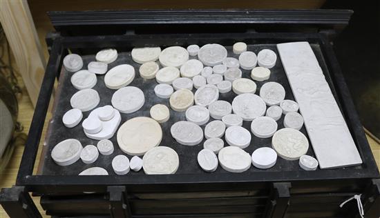 A collection of 19th century Grand Tour classical plaster intaglios,
